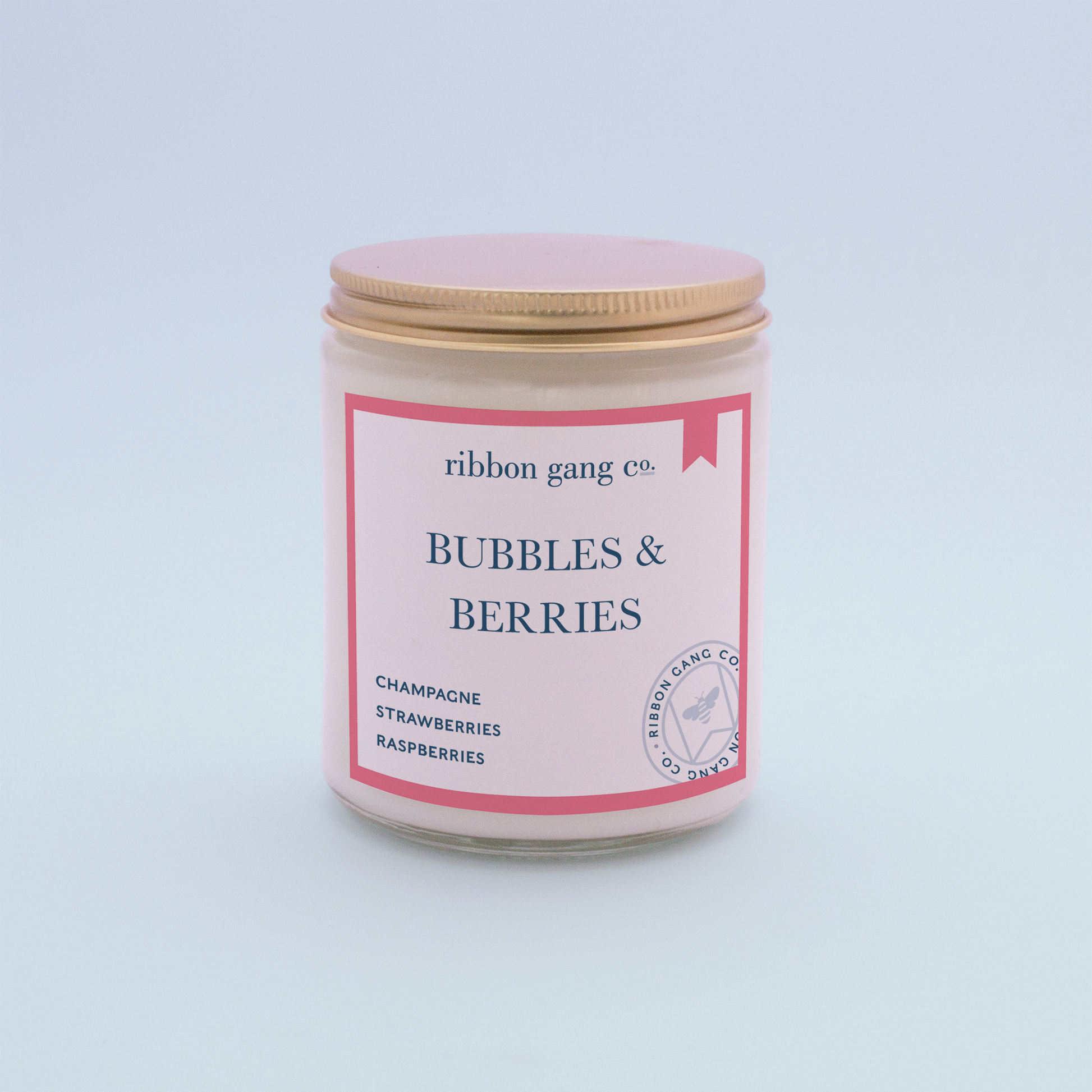 Bubbles & Berries Candle in a clear jar with a gold lid