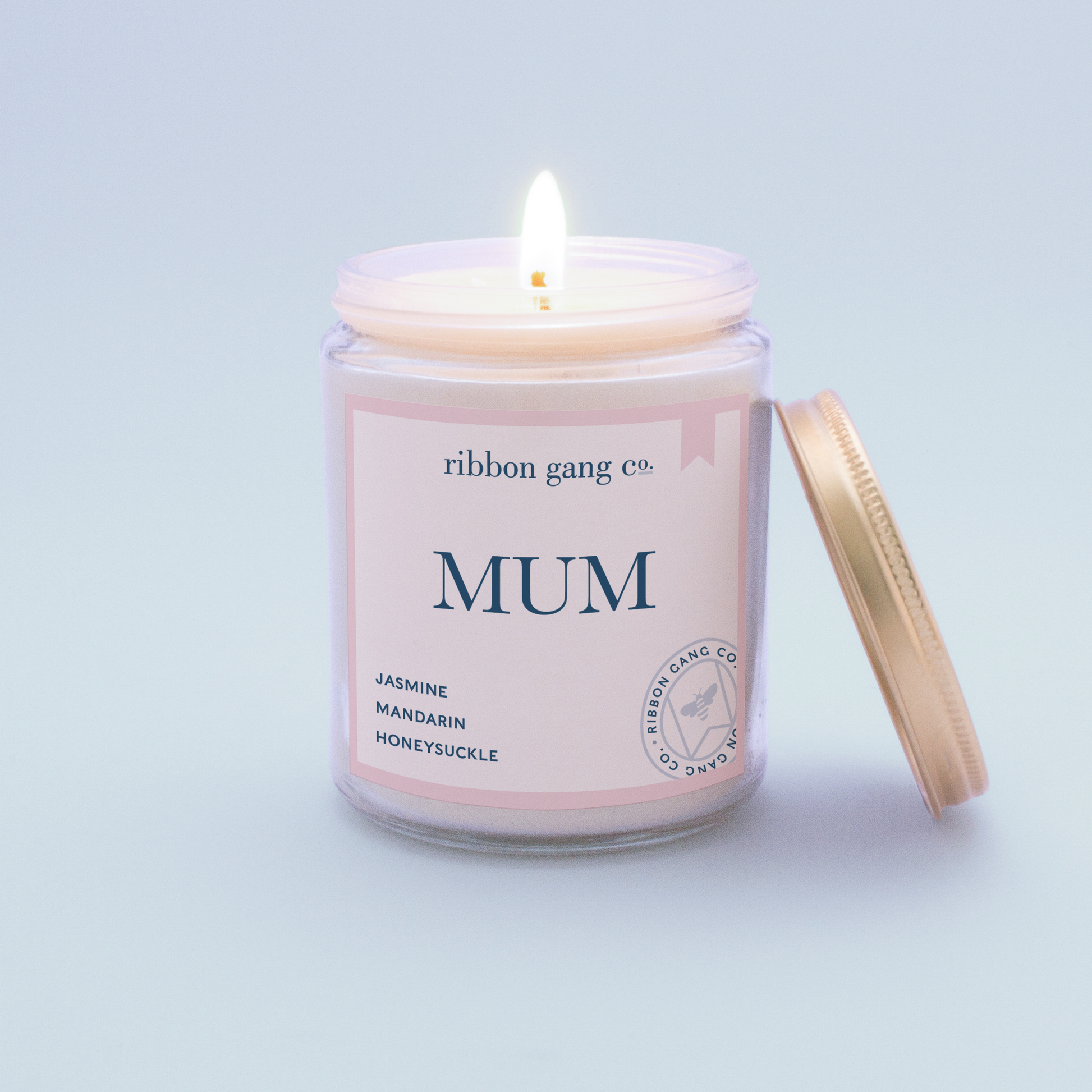 Mum Candle in a clear jar burning