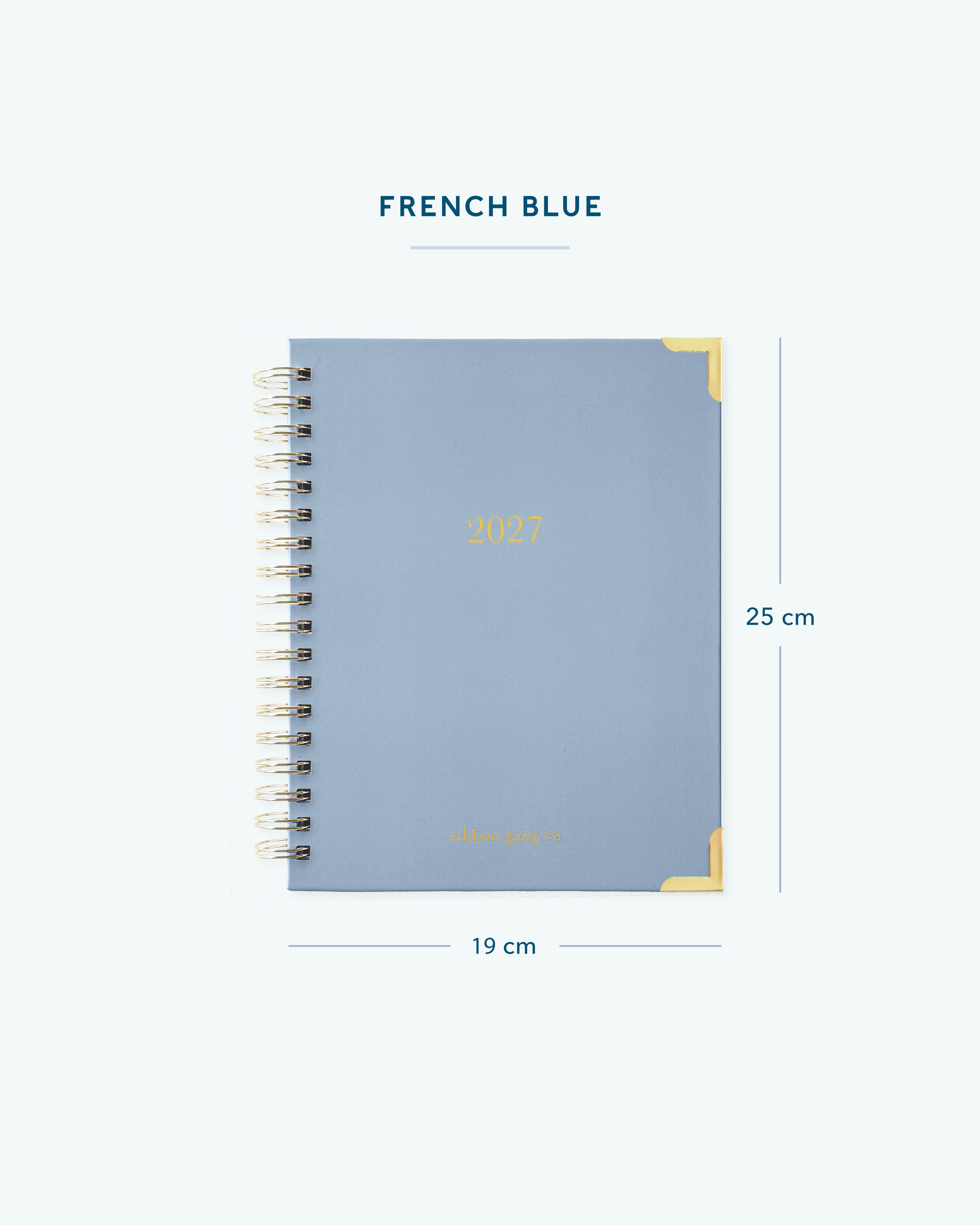 A French blue spiral bound 2027 planner with gold lettering and gold corners on a white background showing dimensions of 25 cm high and 19 cm wide.