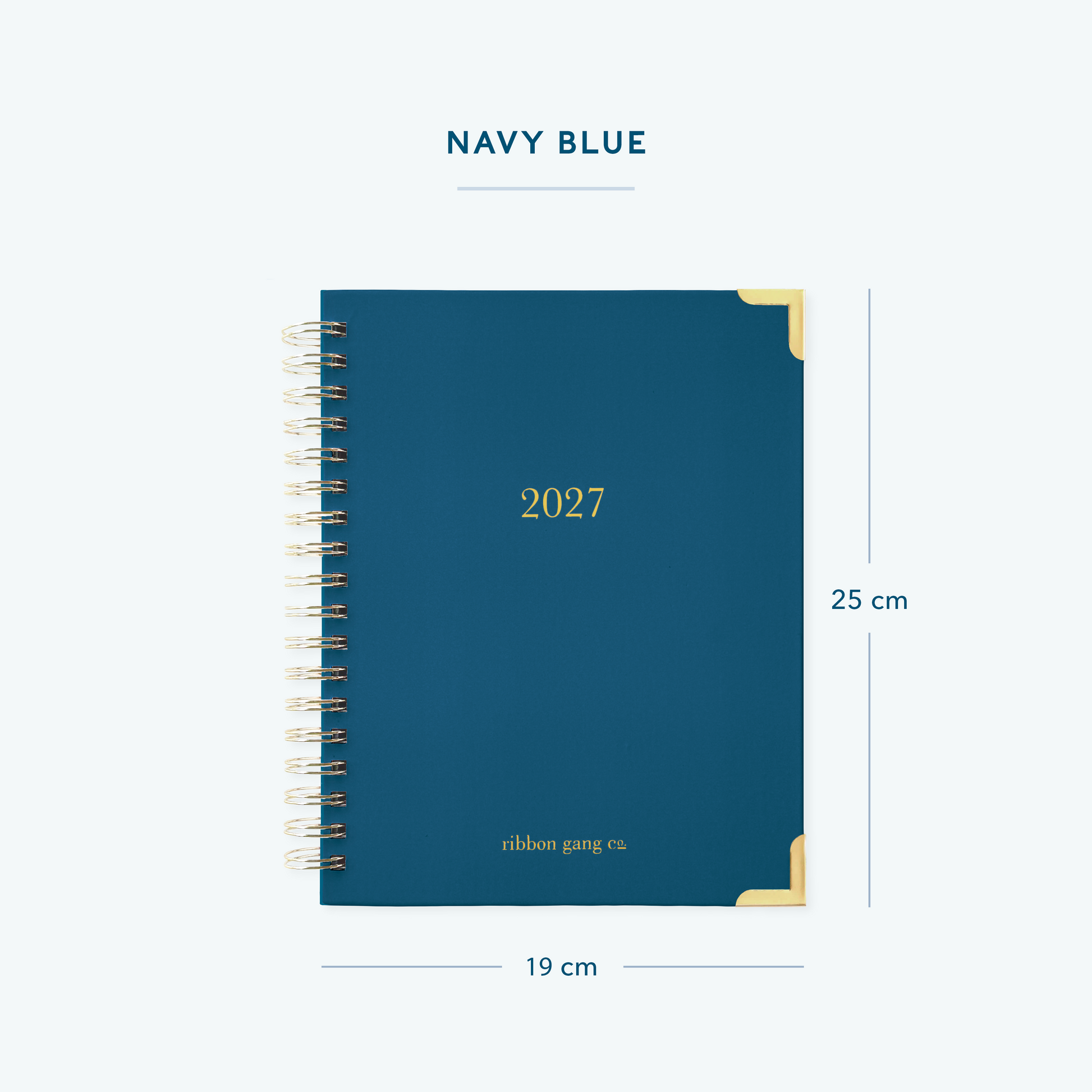 A navy blue spiral bound 2027 planner with gold lettering and gold corners on a white background showing dimensions of 25 cm high and 19 cm wide.