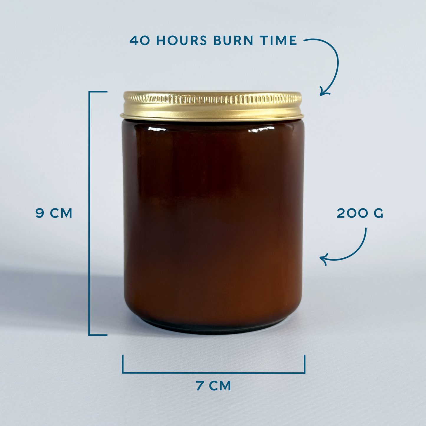 Amber candle jar with gold lid and measurements on a light grey background.