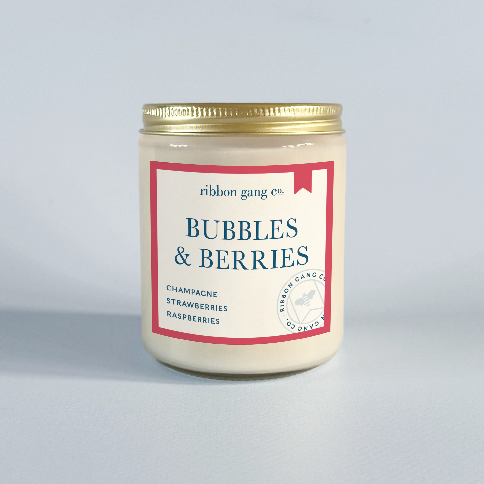 Candle jar labeled 'Bubbles & Berries' by Ribbon Gang Co. on a light grey background.